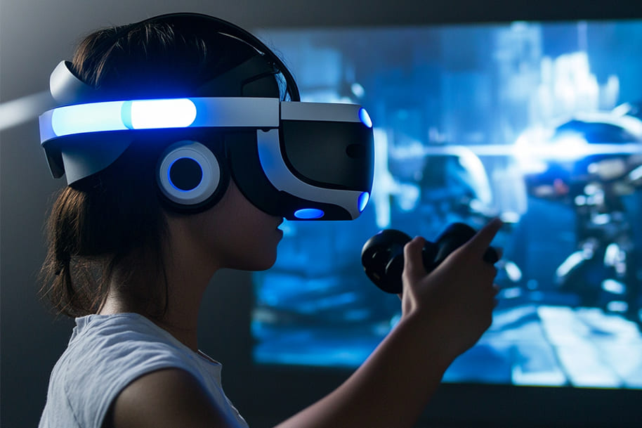 Person wearing a VR headset and holding a controller, deeply engaged in a virtual gaming environment. The image showcases the immersive capabilities of virtual reality, illustrating its impact on the future of video games and interactive experiences.